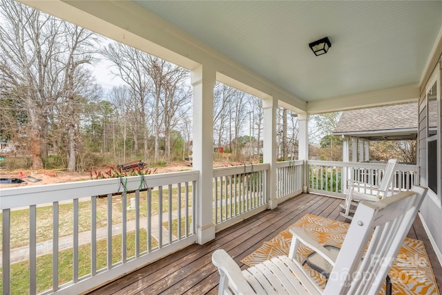 wooden terrace featuring a porch