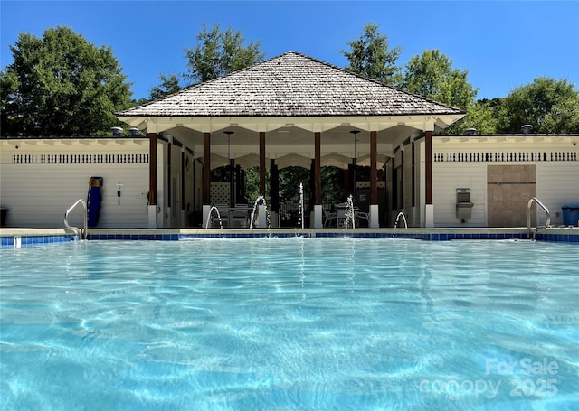 community pool with a gazebo