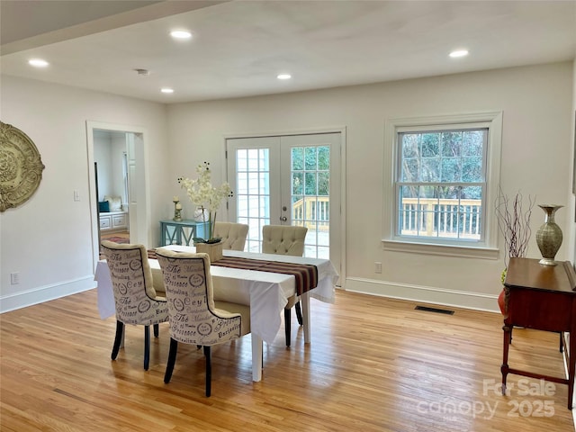 dining area with light wood-type flooring, french doors, visible vents, and recessed lighting