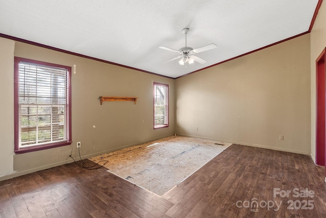 unfurnished room with a ceiling fan, baseboards, wood-type flooring, and ornamental molding