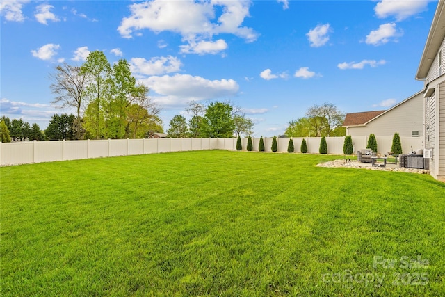 view of yard featuring a patio, a fenced backyard, and central AC unit