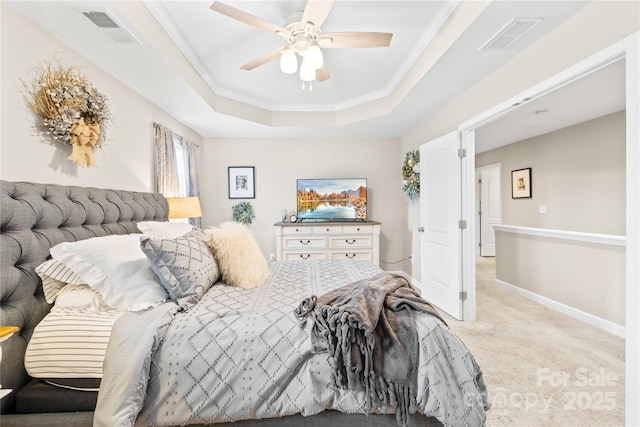 bedroom featuring a tray ceiling, crown molding, carpet, and visible vents