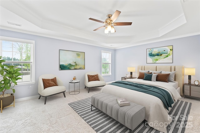 carpeted bedroom featuring baseboards, ornamental molding, a raised ceiling, visible vents, and ceiling fan