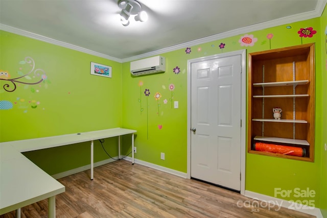 office area with wood finished floors, baseboards, a wall mounted air conditioner, and ornamental molding