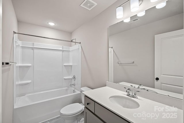 full bathroom with visible vents, toilet, vanity, and shower / tub combination