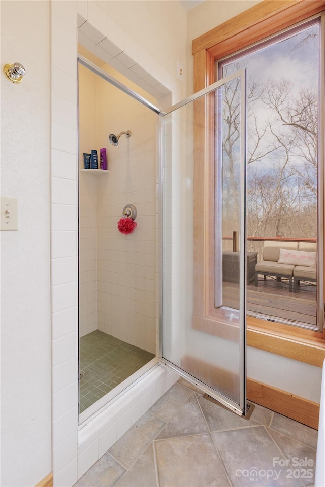 bathroom featuring a shower stall