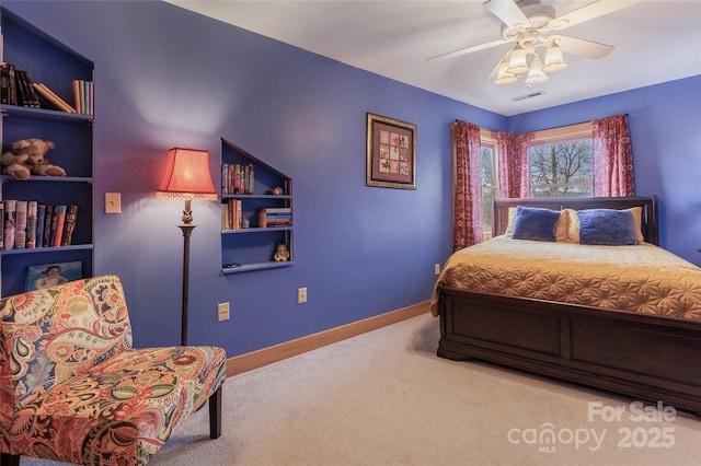 bedroom with visible vents, baseboards, ceiling fan, and carpet flooring