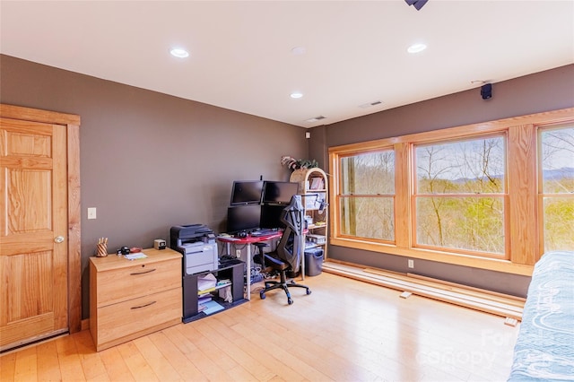 office with recessed lighting, light wood-type flooring, and visible vents