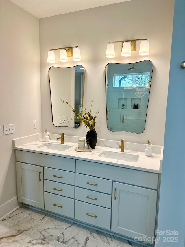 bathroom featuring a shower stall, marble finish floor, and a sink