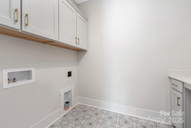 washroom featuring baseboards, cabinet space, electric dryer hookup, washer hookup, and tile patterned flooring