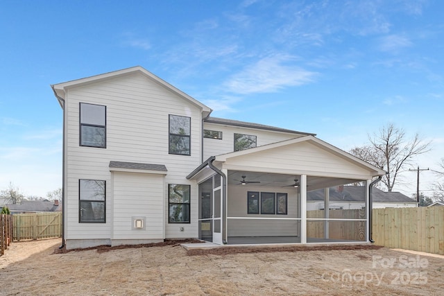 back of property featuring a ceiling fan, a fenced backyard, and a sunroom