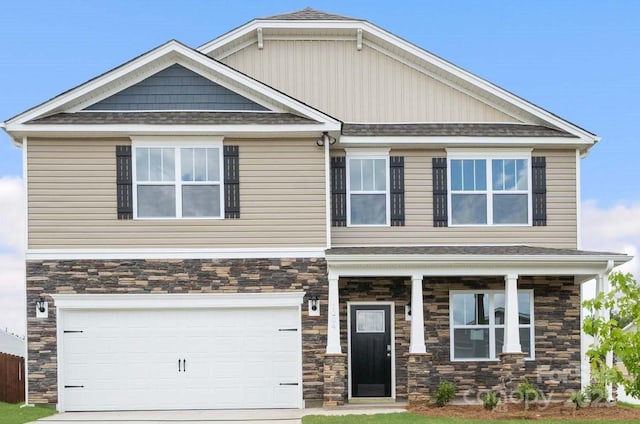 craftsman house featuring concrete driveway, an attached garage, and stone siding