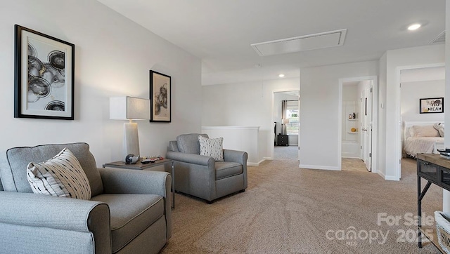 sitting room featuring visible vents, baseboards, attic access, carpet floors, and recessed lighting