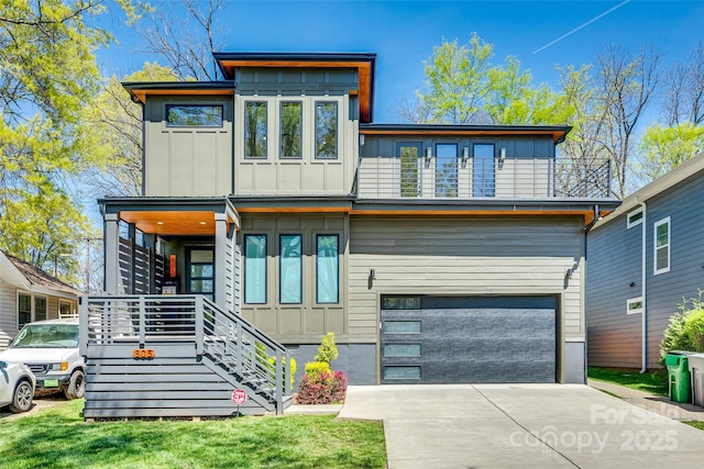 modern home with board and batten siding, a garage, concrete driveway, and a balcony