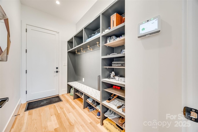 mudroom featuring light wood-type flooring and recessed lighting