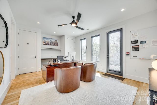home office with light wood-style flooring, ceiling fan, and recessed lighting