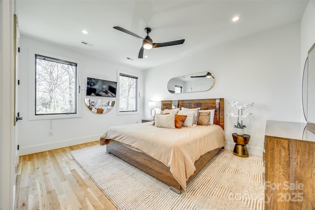 bedroom with visible vents, baseboards, light wood-type flooring, and recessed lighting