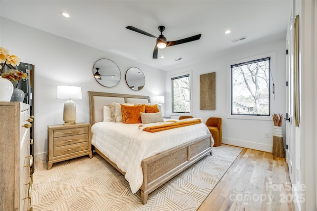 bedroom with light wood-style floors, baseboards, visible vents, and recessed lighting