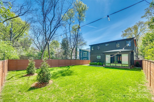 view of yard featuring a fenced backyard
