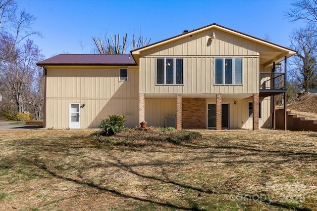 rear view of property featuring central AC unit