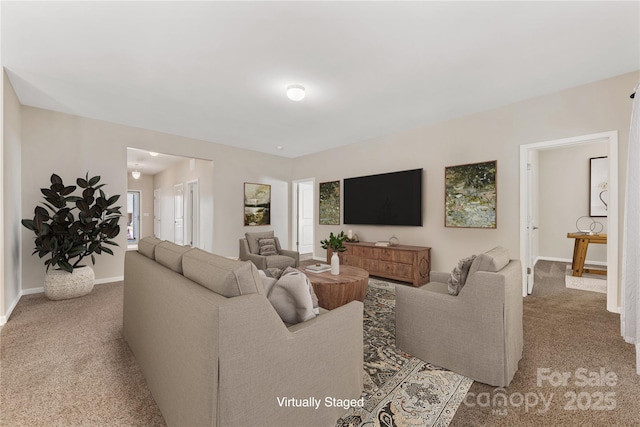 living area with carpet flooring and baseboards