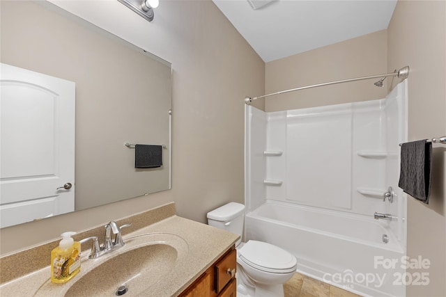 bathroom featuring toilet, vanity, and  shower combination