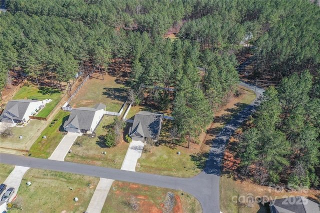 aerial view with a wooded view