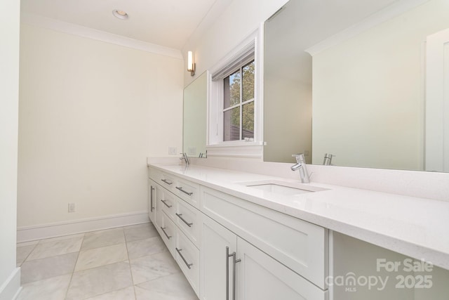 1665 Sterling Rd, Charlotte, NC 28209 - bathroom with double vanity, crown molding, baseboards, and marble finish flooring