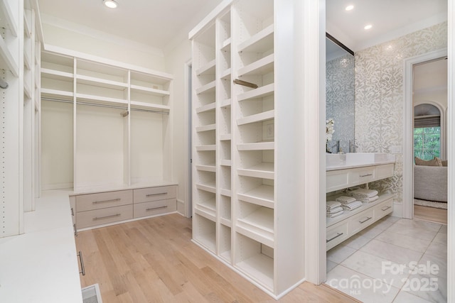 1665 Sterling Rd, Charlotte, NC 28209 - walk in closet with light wood-type flooring