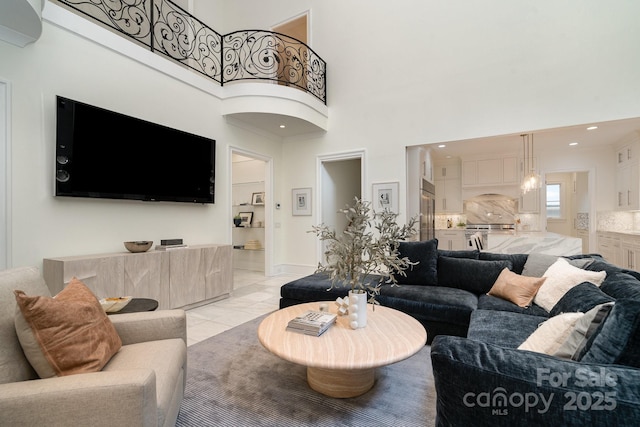 1665 Sterling Rd, Charlotte, NC 28209 - living area featuring a towering ceiling and light tile patterned floors