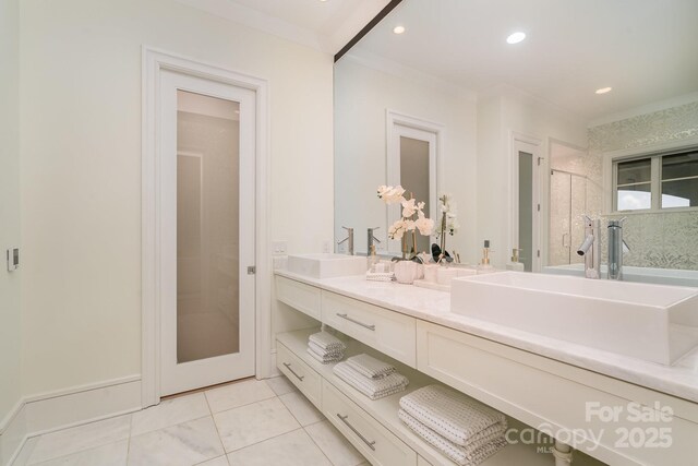 1665 Sterling Rd, Charlotte, NC 28209 - full bath with double vanity, tile patterned floors, a shower, and recessed lighting