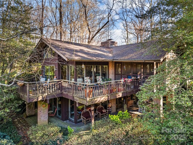 32 Fairway Rdg, Lake Wylie, SC 29710 - back of property with brick siding, a wooden deck, a chimney, and a shingled roof