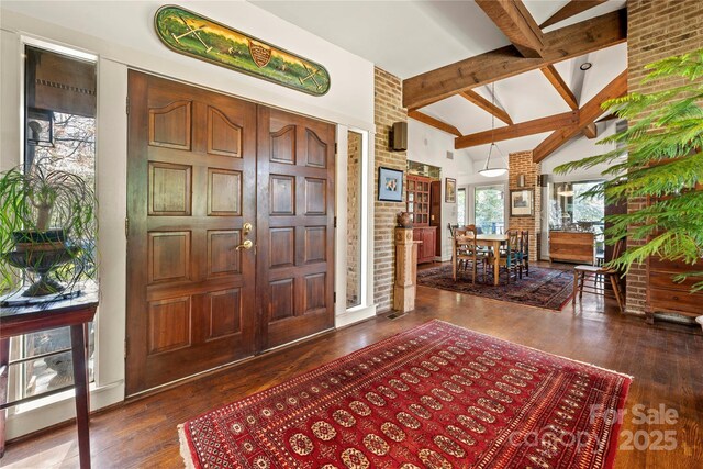 32 Fairway Rdg, Lake Wylie, SC 29710 - foyer featuring beam ceiling, wood finished floors, brick wall, and high vaulted ceiling