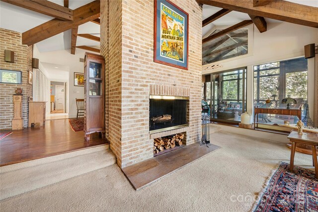 32 Fairway Rdg, Lake Wylie, SC 29710 - carpeted living room with beamed ceiling, a fireplace, and high vaulted ceiling
