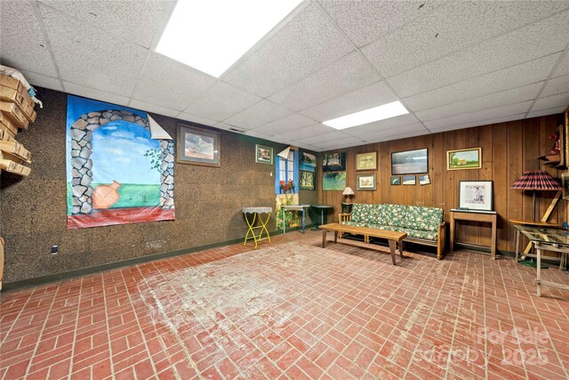 32 Fairway Rdg, Lake Wylie, SC 29710 - game room featuring wood walls, baseboards, a paneled ceiling, and brick floor