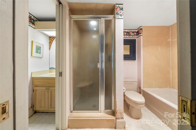 32 Fairway Rdg, Lake Wylie, SC 29710 - full bath with vanity, a tub to relax in, a stall shower, tile patterned floors, and toilet