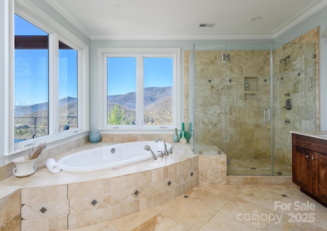 full bathroom featuring visible vents, a shower stall, a garden tub, ornamental molding, and vanity