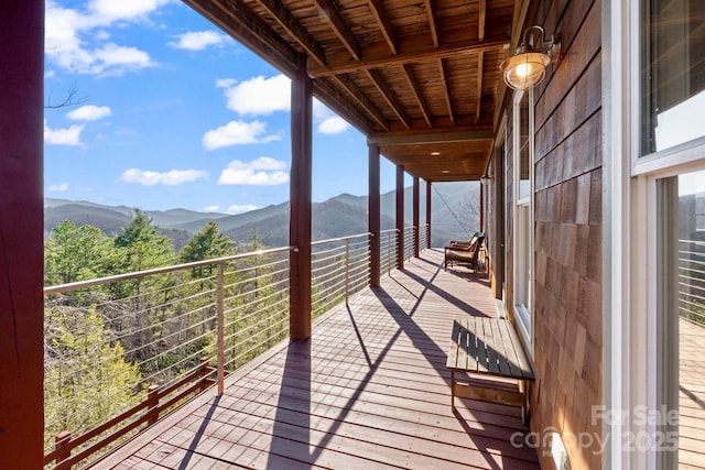 wooden terrace with a mountain view