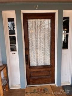 doorway to outside with ornamental molding