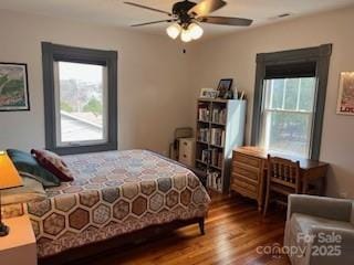 bedroom featuring dark wood finished floors