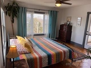 bedroom featuring wood finished floors