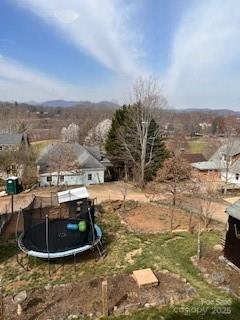 view of yard featuring a trampoline