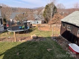 view of yard featuring a trampoline