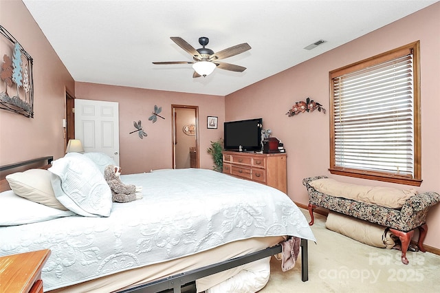 bedroom featuring visible vents, ceiling fan, and carpet flooring