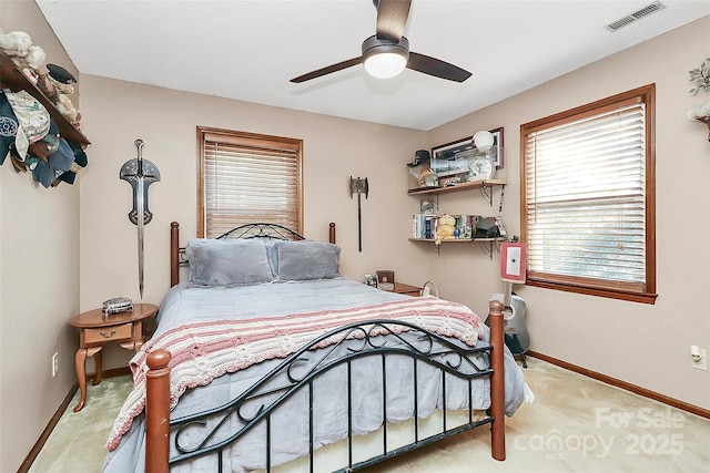 bedroom with ceiling fan, carpet, visible vents, and baseboards