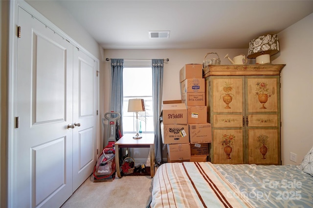 bedroom featuring visible vents and carpet flooring