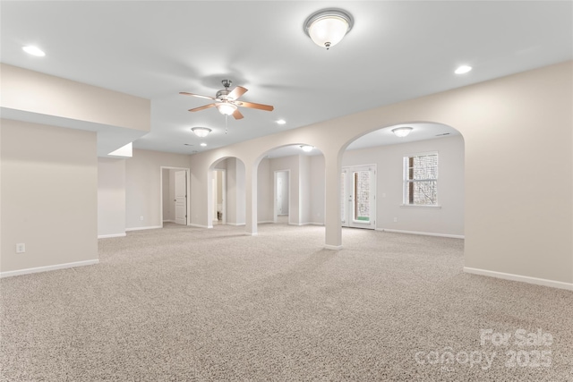 3104 Streamhaven Dr, Indian Land, SC 29707 - unfurnished room featuring baseboards, arched walkways, carpet flooring, and a ceiling fan