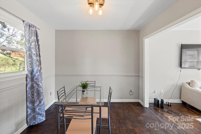 dining area featuring baseboards