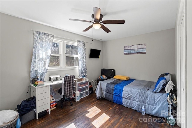 bedroom featuring a ceiling fan and wood finished floors