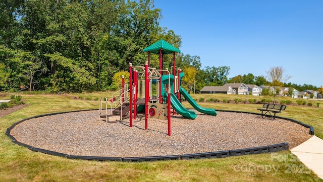 communal playground featuring a yard